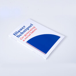 Book cover mockup titled “Blauer Schnipsel: Co-generating a social fabric,” featuring blue and red typography on a white cover with a large abstract blue geometric shape. 